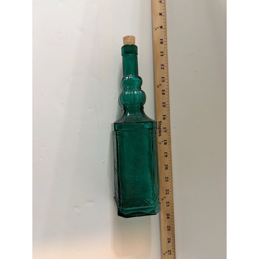 vtg emerald green glass decanter bottle with embossed sides and cork stopper